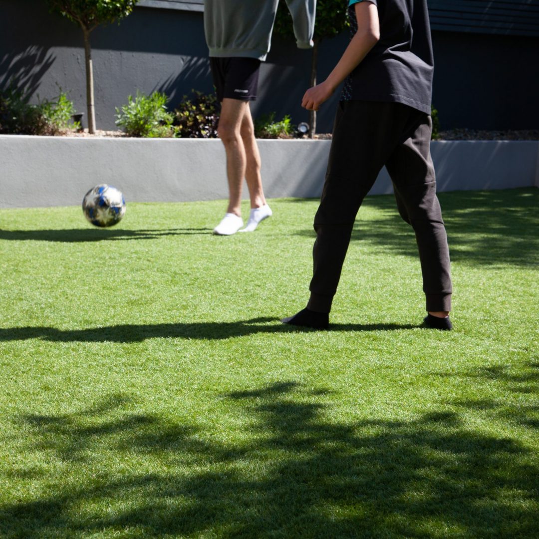 playing soccer on grass